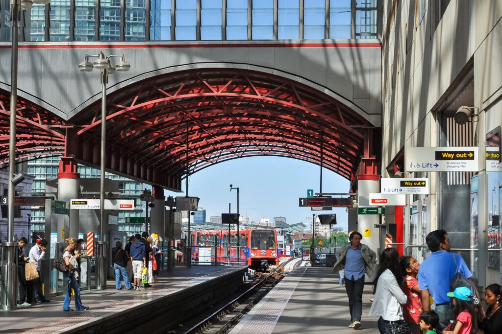 A train is approaching the Canary Wharf station.