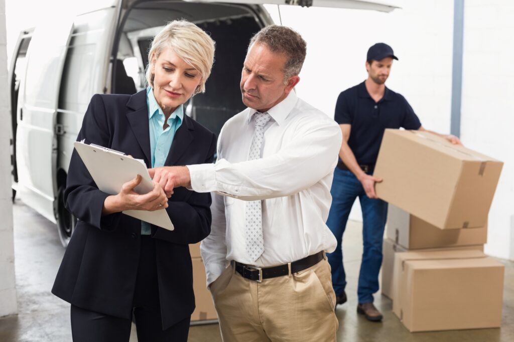 The office manager is speaking with the professional Man and Van during the office move